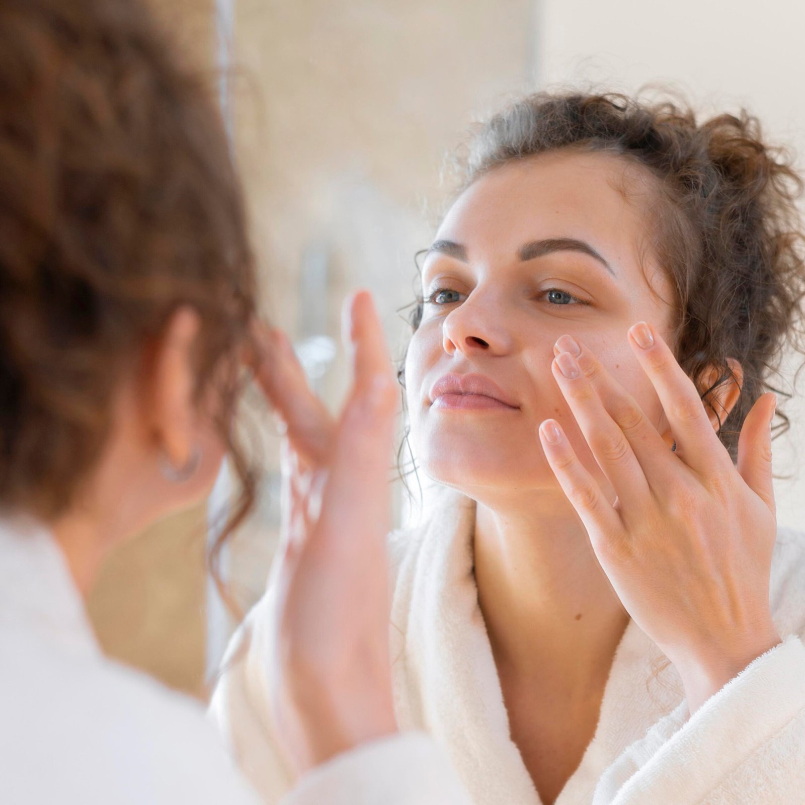 Lumeskinlab customer applying cream